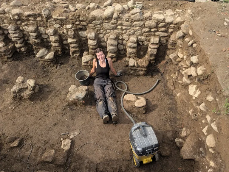 Spangler at an ancient Roman archaeological site in East Tirol, Austria (Aguntum Archaeological site), digging to uncover the architecture and building phases of the city.