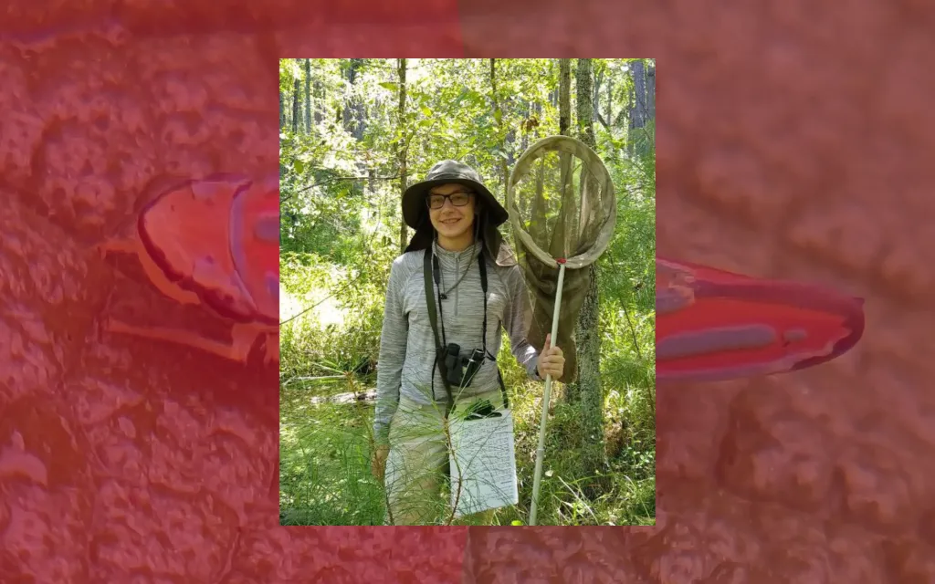 Kiegan Baranski is featured in this image holding a net meant to capture insects. The background image is a leafhopper found in Missouri.
